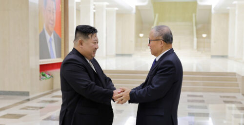 Kim meets with Chinese official after two cheer on nukes at military parade