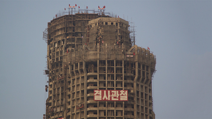 N.Korean construction workers complete framework of 70-floor skyscraper