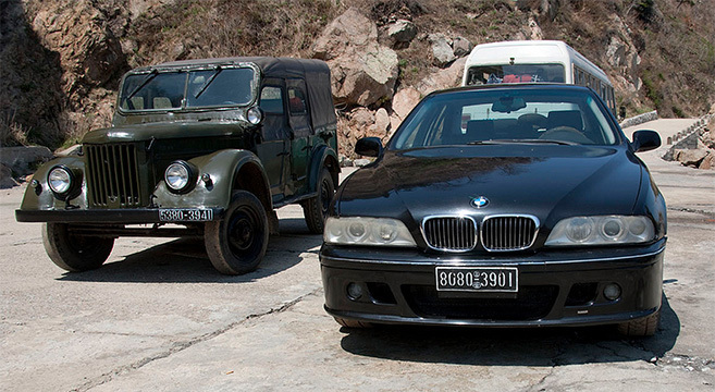 DPRK military vehicle pictured next to BMW on beach in North Korea | Picture: Eric Lafforgue