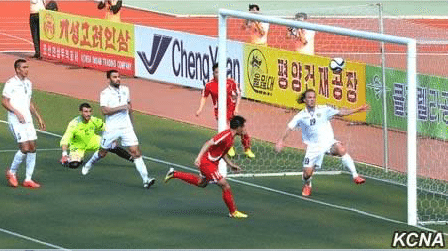 North Korean soccer match features conspicuous ads