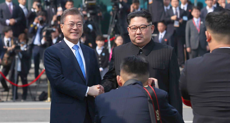 Kim Jong Un and Moon Jae-in share historic first handshake at Panmunjom