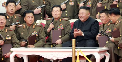Kim Jong Un gifts guns to army officers as North Korea marks war anniversary