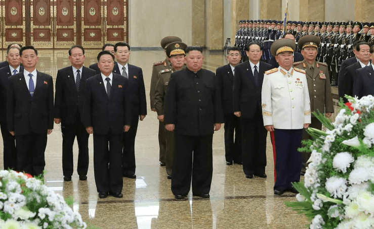 Nine years after taking power, Kim Jong Un visits his father’s grave