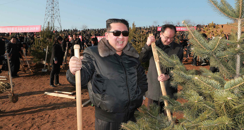 Shovel in hand, Kim Jong Un plants trees at new 10,000-home project in Pyongyang