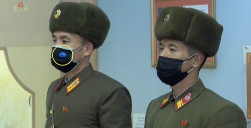 More North Koreans sticking mysterious objects on face masks, state media shows