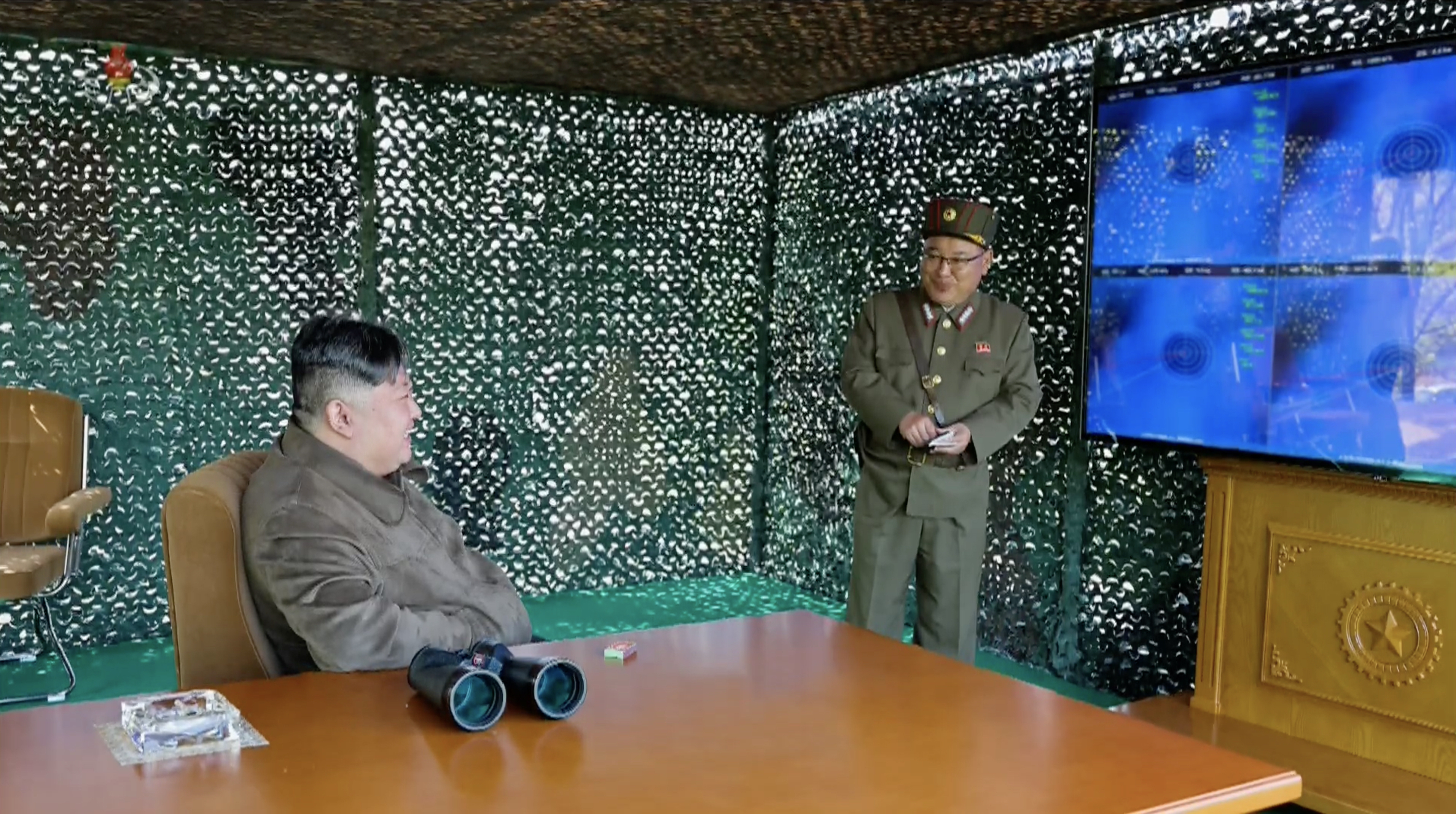 kctv-apr23-2024-kju-salvo-missile-launch-test-600mm-mlrs-kn25-jindallae-guesthouse-command-and-control-systems-27-observation-stand-kim-jong-sik-trajectory-screens-target-island-east-coast.jpg