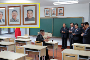 Kim Jong Un displays portrait next to predecessors in personality cult boost